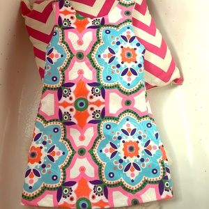 Girls dress with cutout and bow on back.